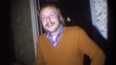 Troy New York USA (1973): Mustaches Man And Brown Coat Looking And Laughing Hard