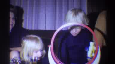 Troy New York USA (1973): A Little Boy Playing In The New Game His Sister Watching