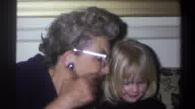 Troy New York USA (1973): A Grandmother Helping Her Granddaughter To Unwrap The