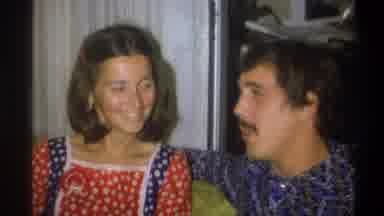 Troy New York USA (1973): Man Tells A Funny Story Next To A Young Girl While Both