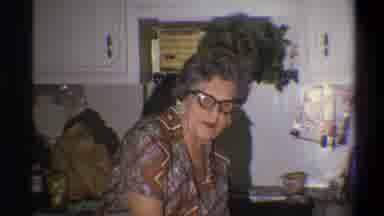 Troy New York USA (1973): An Older Woman Wearing Glasses And Earrings Speaking In