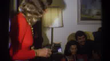 Troy New York USA (1973): A Women In The Orange Dress Taking Photograph Of A