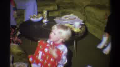 Troy New York USA-1973: Two Blond Boy Brothers Opening Christmas Gifts In Living
