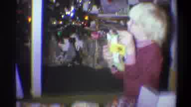 Troy New York USA (1973): Blond Boys Opening Their Presents In Front Of Parents On