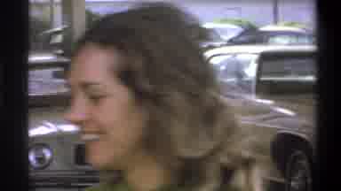 Troy New York USA-1973: Young Lady Helping An Older Gentleman Load Groceries