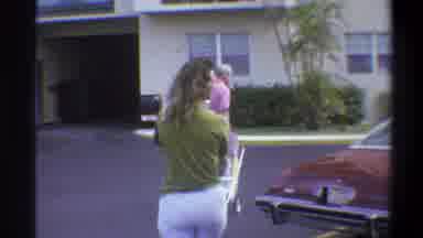Troy New York USA (1973): Couple With Two Children One In A Cart Being Carried By