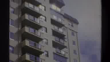 Troy New York USA (1973): A Very Tall Residential Building With Windows And A
