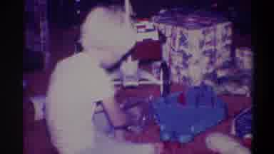 Troy New York USA (1973): White Child With A White Shirt And Pants Toying With A