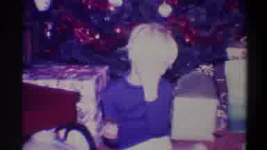 Troy New York USA (1973): Man Wearing Brown Sweater Sitting And Talking On Plaid