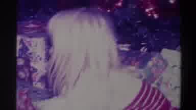 Troy New York USA (1973): A Small Blonde Child Sitting In Front Of A Christmas