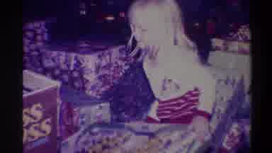 Troy New York USA (1973): Young Blond Girl Opening Christmas Gift Toy Among