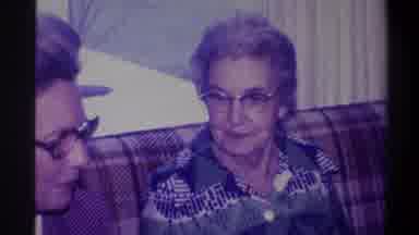 Troy New York USA (1973): Old Grandma Looking On At Her Daughter Speak With
