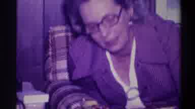 Troy New York USA (1973): Woman Wearing Brown Suit Glasses Handing Christmas Gift