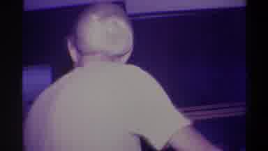 Troy New York USA (1973): Lady In Long Tanned Tied Hair Dress Bending Down To Get
