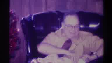 Troy New York USA (1973): An Overweight Man With Glasses Sitting In A Large Chair