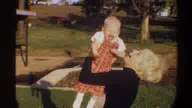 Gainsville Florida USA (1974): Blond Mother Tossing And Holding Blond Baby Park