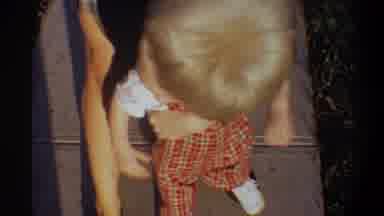 Gainsville Florida USA (1974): Human Blonde Baby Overalls Red Rocks Tile Floor