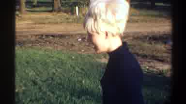 Gainsville Florida USA (1974): A Young Blonde Haired Woman Acts Nervous While