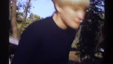 Gainsville Florida USA (1974): Mother Wearing Turtleneck Watching Child Wearing