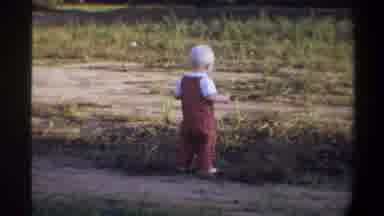 Gainsville Florida USA (1974): Toddler Waddling Through Grass