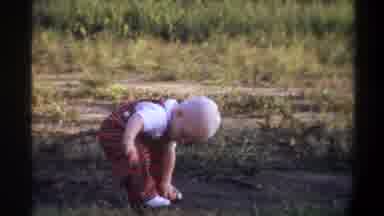 Gainsville Florida USA (1974): Little Boy Is Playing In The Grass In An Open Field