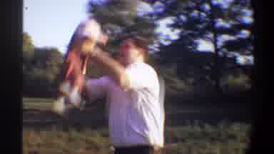 Gainsville Florida USA (1974): Father Playing Airplane With Son