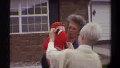 Gainsville Florida USA-1974: Baby In Red Sweater With Mother And Grandmother