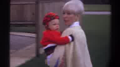 Gainsville Florida USA (1974): Mother Of Baby Helping The Infant Wave Hello Or