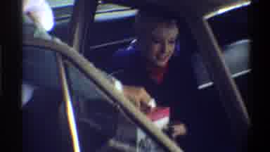Gainsville Florida USA (1974): A Lady In The Car Is Given A Baby And A Gift From