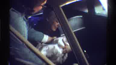 Gainsville Florida USA (1974): Mother In A Car With A Newborn Baby Driving To Her