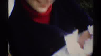 Gainsville Florida USA (1974): Woman Wearing Black Coat Holding Baby Wrapped White