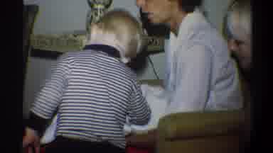 Gainsville Florida USA (1974): Young Child Admiring Infant Being Held