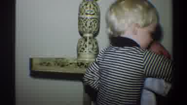 Gainsville Florida USA (1974): Little Blonde Haired Boy Sweetly Playing With A