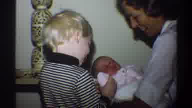 Gainsville Florida USA (1974): A Happy Mother Showing Her Baby To Another Blond