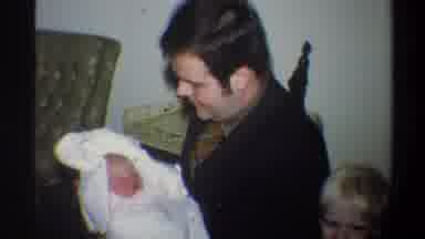 Gainsville Florida USA (1974): Man And Child Joyous About A Baby