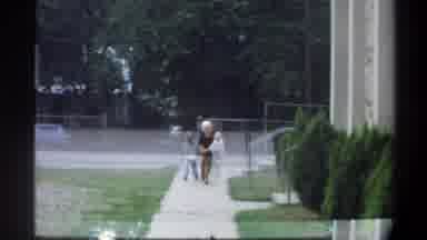 Gainsville Florida USA (1974): A Blonde Woman With Her Blond Children Walking Down