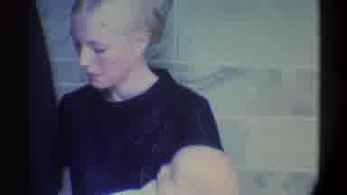 Gainsville Florida USA (1974): A Pretty Young Lady With A Baby In Her Arms Inside
