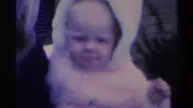 Gainsville Florida USA (1974): A Small Child Frowns In A Puffy Pink Coat