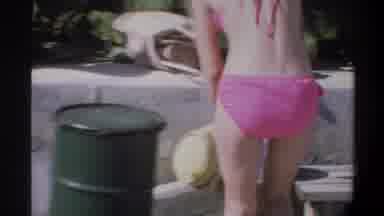 Gainsville Florida USA (1974): Woman Swimwear Helping Guide Small Boy In Park