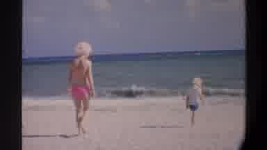 Gainsville Florida USA (1974): A Mother And Her Son Walk On A Beach Together