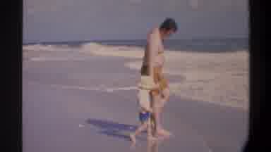 Gainsville Florida USA (1974): Father And Son Playing In The Water On A Hot Summer