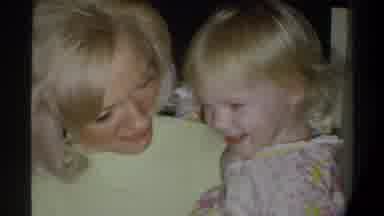 Gainsville Florida USA (1974): A Blonde Woman Playing With Her Small Child And