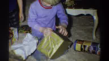 Gainsville Florida USA (1974): Children Opening Christmas Presents And One