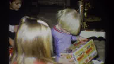 Gainsville Florida USA (1974): A Child Opening A Gift
