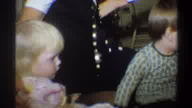 Gainsville Florida USA (1974): A Young Boy In Green Pajamas Excitedly Playing With