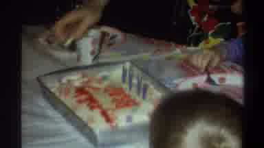 Gainsville Florida USA (1974): Little Girl Cutting Her Birthday Cake While Her Mom