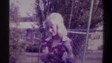 Gainsville Florida USA (1974): A Blonde Woman Holds A Glass And Swings In A Swing