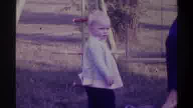 Gainsville Florida USA (1974): Small Blonde Haired Child Standing In Front Of A