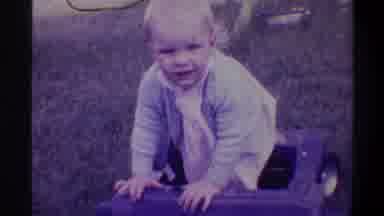 Gainsville Florida USA (1974): The Child Is Playing In The Garden Enjoying Himself