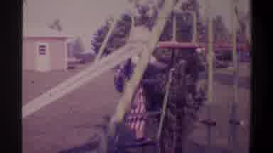 Gainsville Florida USA (1974): A Child Having Fun Playing On The Slider
